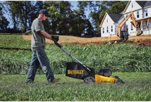 man using DEWALT DCMW220P2 Lawn Mower