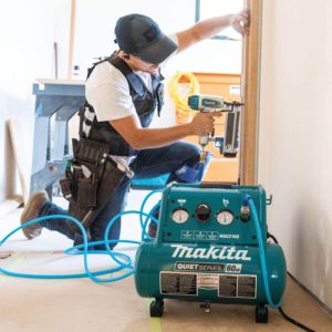 man using Makita MAC210Q Electric Air Compressor